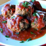 Melty Cheese-Stuffed Beef Meatballs Simmered in Marinara