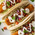 Crisp Baja Fish Tacos with Zesty White Sauce Delight