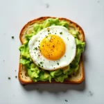 Elevate Breakfast: Simple Avocado Toast Topped with Egg