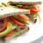 Fresh Twist: Avocado, Tomato & Mozzarella Sandwich Delight