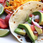 Savor Blackened Fish Tacos with Zesty Avocado Crema Delight